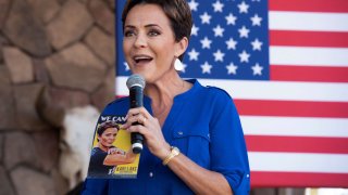 Arizona republican candidate for governor Kari Lake greets the audience during a stop on the Truth and Courage PAC’s Take Back America Bus Tour with Sen. Ted Cruz ahead of the midterm elections, at San Tan Flat in Queen Creek, Arizona, on Oct. 5, 2022.