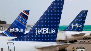 JetBlue Airways aircraft are pictured at departure gates at John F. Kennedy International Airport in New York.