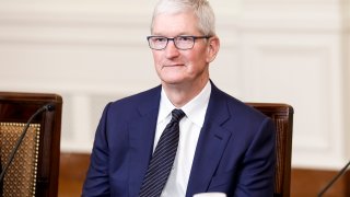 Apple CEO Tim Cook listens as President Joe Biden speaks during a roundtable with American and Indian business leaders in the East Room of the White House in Washington, D.C., June 23, 2023.