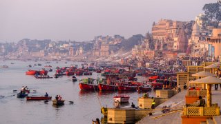 Rowing boats on the holy river Ganges in India.