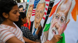 Students give final touches to paintings of U.S. President Joe Biden, Indian Prime Minister Narendra Modi and Italian Prime Minister Giorgia Meloni at an art school in Mumbai ahead of the two-day G20 summit in New Delhi, Sept. 5, 2023.