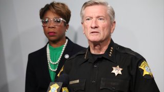 Richland County Sheriff Leon Lott, right, and Councilmember Gretchen Barron speak