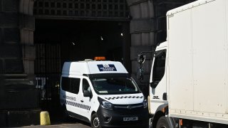 A prison van exits through the gates of HM Prison Wandsworth in south London on September 7, 2023, a day after terror suspect, Daniel Abed Khalife escaped from the prison while awaiting trial. British authorities have issued an all-ports alert to track down a former soldier awaiting trial on terrorism charges, after he escaped from jail by clinging to the bottom of a delivery van.