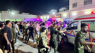 Soldiers and emergency responders outside the Hamdaniyah general hospital in Al-Hamdaniyah, Iraq on Sept. 27, 2023.