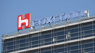 The Foxconn logo displayed on a Foxconn building in Taipei on 31 January 2019. Taiwan’s Foxconn, the world’s largest contract electronics maker, raised its full-year business outlook on Monday thanks to strong sales of smartphones and servers despite concerns of slowing demand due to rising inflation.