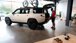 Taylor looks at Rivian electric trucks at the auto maker’s newly opened storefront in the Meatpacking District of Manhattan on June 23, 2023 in New York City.