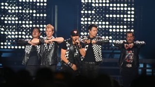 ATLANTA, GEORGIA – JULY 07: Jonathan Knight, Joey McIntyre, Donnie Wahlberg, Jordan Knight and Danny Wood of New Kids On The Block perform onstage during “The Mixtape” tour at State Farm Arena on July 7, 2022 in Atlanta, Georgia.