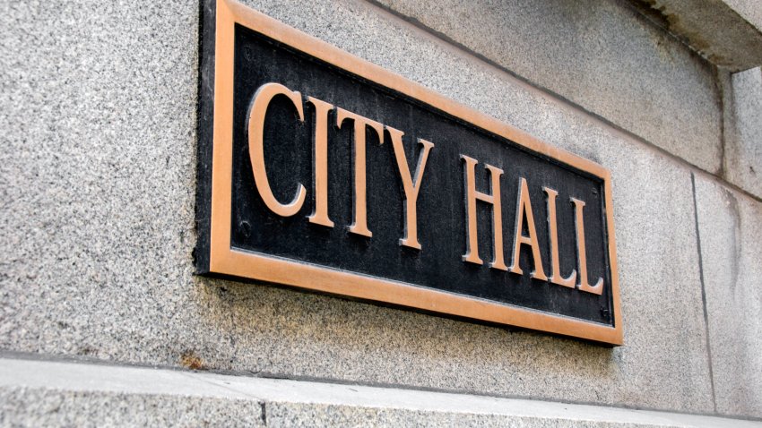 Brass City Hall sign on a stone building.Check out these related images: