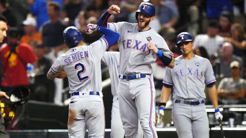 PHOENIX, AZ – OCTOBER 31: Marcus Semien #2 of the Texas Rangers celebrates with Jonah Heim #28 after hitting a two-run home run in the third inning during Game 4 of the 2023 World Series between the Texas Rangers and the Arizona Diamondbacks at Chase Field on Tuesday, October 31, 2023 in Phoenix, Arizona.