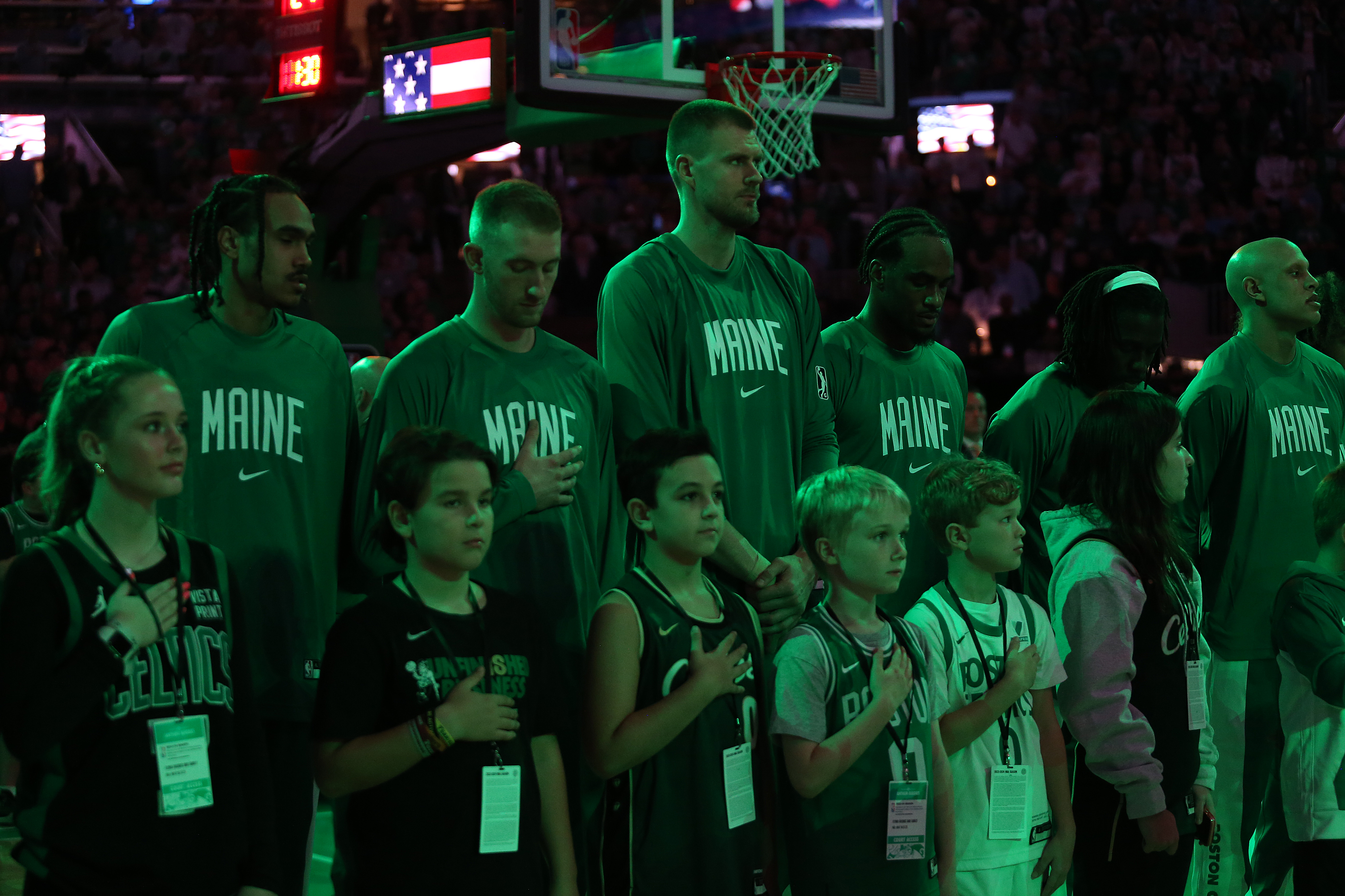 BOSTON, MASSACHUSETTS – OCTOBER 27: The Boston Celtics players wear “Maine” shirts during the National Anthem at TD Garden on October 27, 2023 in Boston, Massachusetts. A man gunned down 18 people with a semi-automatic rifle in a bowling alley and a bar where locals were enjoying an evening out on October 25 2023 in Lewiston, Maine.  NOTE TO USER: User expressly acknowledges and agrees that, by downloading and or using this photograph, User is consenting to the terms and conditions of the Getty Images License Agreement. (Photo by Maddie Schroeder/Getty Images)