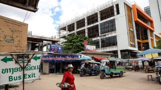 A pedestrians at a bus station in Vientiane, Laos, on Saturday, June 24, 2023.