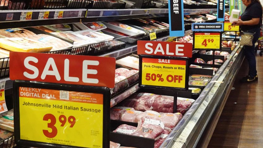 A person shops in a grocery store as prices are displayed on October 12, 2023 in Los Angeles, California. 