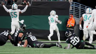 Jevon Holland of the Miami Dolphins scores a 99-yard touchdown off of an interception thrown by Tim Boyle of the New York Jets during the second quarter in the game at MetLife Stadium on Nov. 24, 2023 in East Rutherford, N.J.