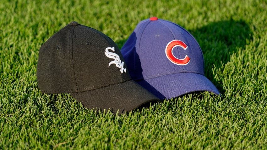 CHICAGO, ILLINOIS – AUGUST 16: Baseball caps are arranged  on the field side by side by a video board cameraman prior to a game between the Chicago Cubs and the Chicago White Sox at Wrigley Field on August 16, 2023 in Chicago, Illinois. (Photo by Nuccio DiNuzzo/Getty Images)
