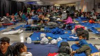 Recently arrived migrants in a makeshift shelter operated by the city of Chicago at O’Hare International Airport on Aug. 31, 2023. (Armando L. Sanchez/Chicago Tribune/Tribune News Service via Getty Images)