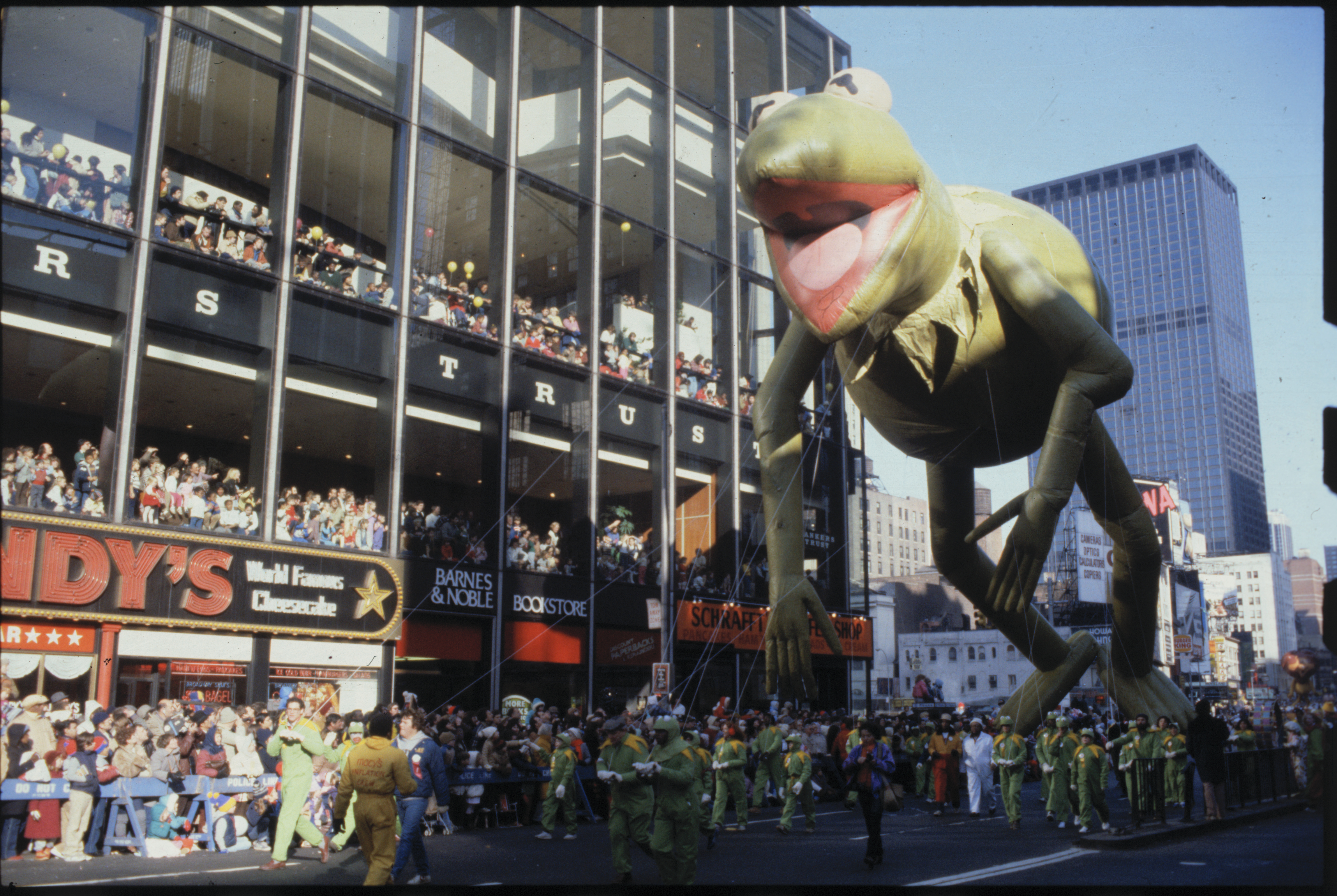 (Original Caption) New York, New York: A giant inflatable balloon of Kermit the Frog makes its way down the parade route during the annual Macy’s Thanksgiving Day Parade in New York City.