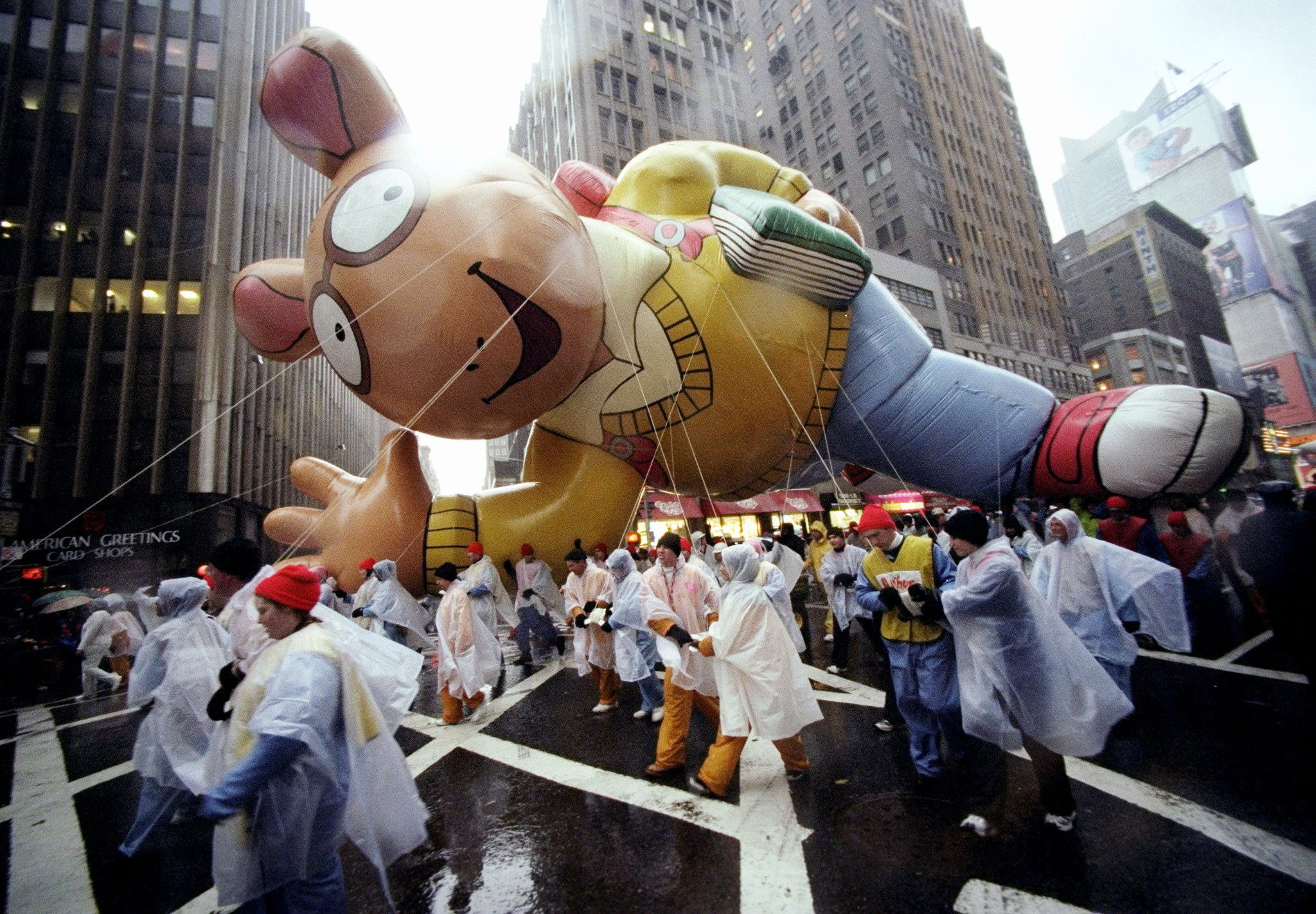 Arthur balloon is guided along the parade route during the 72nd annual Macy’s Thanksgiving Day Parade. (Photo by David Handschuh/NY Daily News Archive via Getty Images)