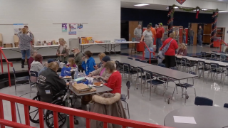 Resident of Livingston, Kentucky, evacuate at a school cafeteria.