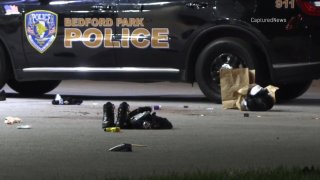 Shoes and other items remain strewn on the ground after a shooting left a Bedford Park police officer injured on Nov. 26, 2023.