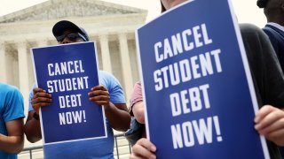 Student debt relief activists participate in a rally at the U.S. Supreme Court on June 30, 2023 in Washington, DC.