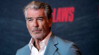 FILE - Pierce Brosnan poses at a special screening of "The Out-Laws," June 26, 2023, at the Regal LA Live theaters in Los Angeles.