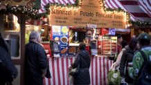 Holiday shoppers stand at a food booth inside the Christkindlmarket in downtown Chicago, Illinois, U.S., on Monday, Nov. 27, 2017. Bloomberg is scheduled to release consumer comfort figures on November 30. Photographer: Christopher Dilts/Bloomberg via Getty Images