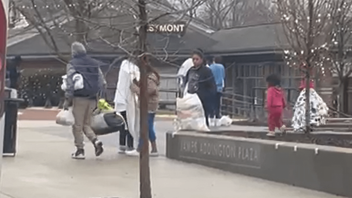 Busload of migrants arrives at Westmont Metra station as suburban dro...