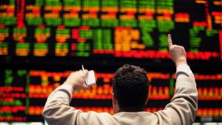 A trader works in the S&P 500 pit on the floor of the CME Group’s Chicago Board of Trade.