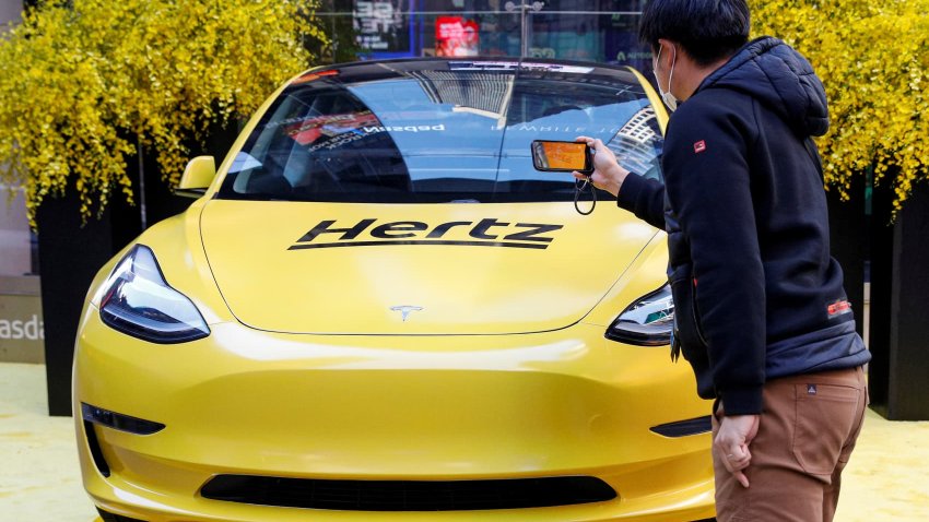 A Hertz Tesla electric vehicle is displayed during the Hertz Corporation IPO at the Nasdaq Market site in Times Square in New York City, U.S., November 9, 2021. 