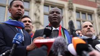 South Africa’s Minister of Justice Ronald Lamola speaks to members of the media on a day judges at the International Court of Justice (ICJ) hear a request for emergency measures by South Africa, who asked the court to order Israel to stop its military actions in Gaza and to desist from what South Africa says are genocidal acts committed against Palestinians during the war with Hamas in Gaza, in The Hague, Netherlands, January 11, 2024. 