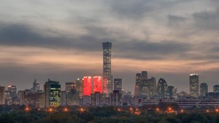 BEIJNG, CHINA – NOVEMBER 13: Illuminated skyscrapers stand at the central business district at sunset on November 13, 2023 in Beijing, China. (Photo by Gao Zehong/VCG via Getty Images)