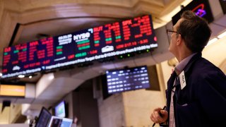Traders work on the floor of the New York Stock Exchange during afternoon trading on January 17, 2024 in New York City. 