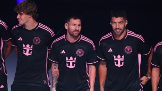 MIAMI, FLORIDA – JANUARY 23: Benjamin Cremaschi #30, Lionel Messi #10 and Luis Suarez #9 of Inter Miami CF unveil new jerseys during the Royal Carribean & Inter Miami CF Launch Event on January 23, 2024 in Miami, Florida. (Photo by Megan Briggs/Getty Images)