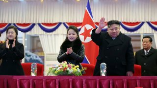 In this photo provided by the North Korean government, North Korean leader Kim Jong Un, second right, with his daughter and his wife Ri Sol Ju, left