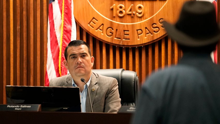 Eagle Pass Mayor Rolando Salinas, left, listens to Kayak outfitter Jessie Fuentes, right, during a city council meeting in Eagle Pass, Texas, July 6, 2023. The mayor of Eagle Pass, a Texas border city that’s at the center of Republican Gov. Greg Abbott’s aggressive measures to curb migrant crossings, accused the state Thursday, Jan. 11, 2024, of a new escalation, saying state troopers closed a large public park along the Rio Grande without asking permission.