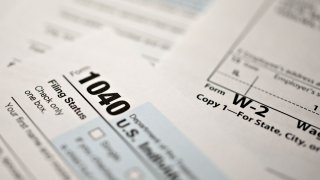 A U.S. Department of the Treasury Internal Revenue Service (IRS) 1040 Individual Income Tax form for the 2019 tax year is arranged for a photograph with a W-2 wage statement in Tiskilwa, Illinois, U.S., on Friday, March 20, 2020. Tax forms and payments wont be due to the Internal Revenue Service until July 15 this year, Treasury Secretary Steven Mnuchin said in a tweet, as the government looks for ways to respond to the coronavirus. Photographer: Daniel Acker/Bloomberg via Getty Images