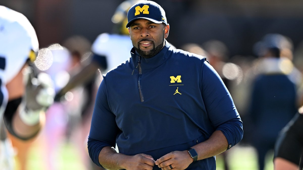 Why was Michigan coach Sherrone Moore fired, and why was he arrested?