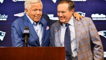 New England Patriots owner Robert Kraft (left) and departing head coach Bill Belichick embrace as they announced Belichick was leaving the team during a news conference at Gillette Stadium in Foxborough, Massachusetts, on Thursday, Jan. 11, 2024.