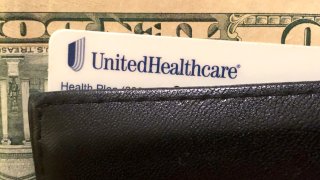 A UnitedHealth Group health insurance card is seen in a wallet, Oct.14, 2019.