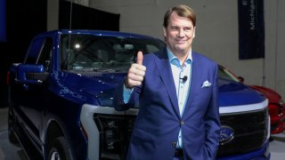 Ford Motor Co., CEO Jim Farley gives the thumbs up sign before announcing Ford Motor will partner with Chinese-based,  Amperex Technology, to build an all-electric vehicle battery plant in Marshall, Michigan, during a press conference in Romulus, Michigan February 13, 2023.
