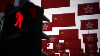 Chinese flags and Hong Kong flags are hung in Tsim Sha Tsui district on Oct. 4, 2023 in Hong Kong, China. The Chinese government imposed a National Security Law in the special administrative region on June 30, 2020.