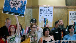 Kansas high school students, family members and advocates rally for transgender rights