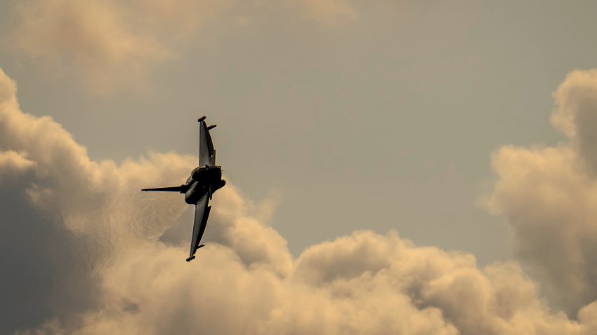 File. A British Royal Air Force Eurofighter Typhoon fighter aircraft flies at RAF Coningsby.