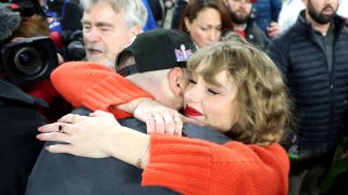 Travis Kelce #87 of the Kansas City Chiefs celebrates with Taylor Swift after a 17-10 victory against the Baltimore Ravens in the AFC Championship Game at M&T Bank Stadium on January 28, 2024 in Baltimore, Maryland.