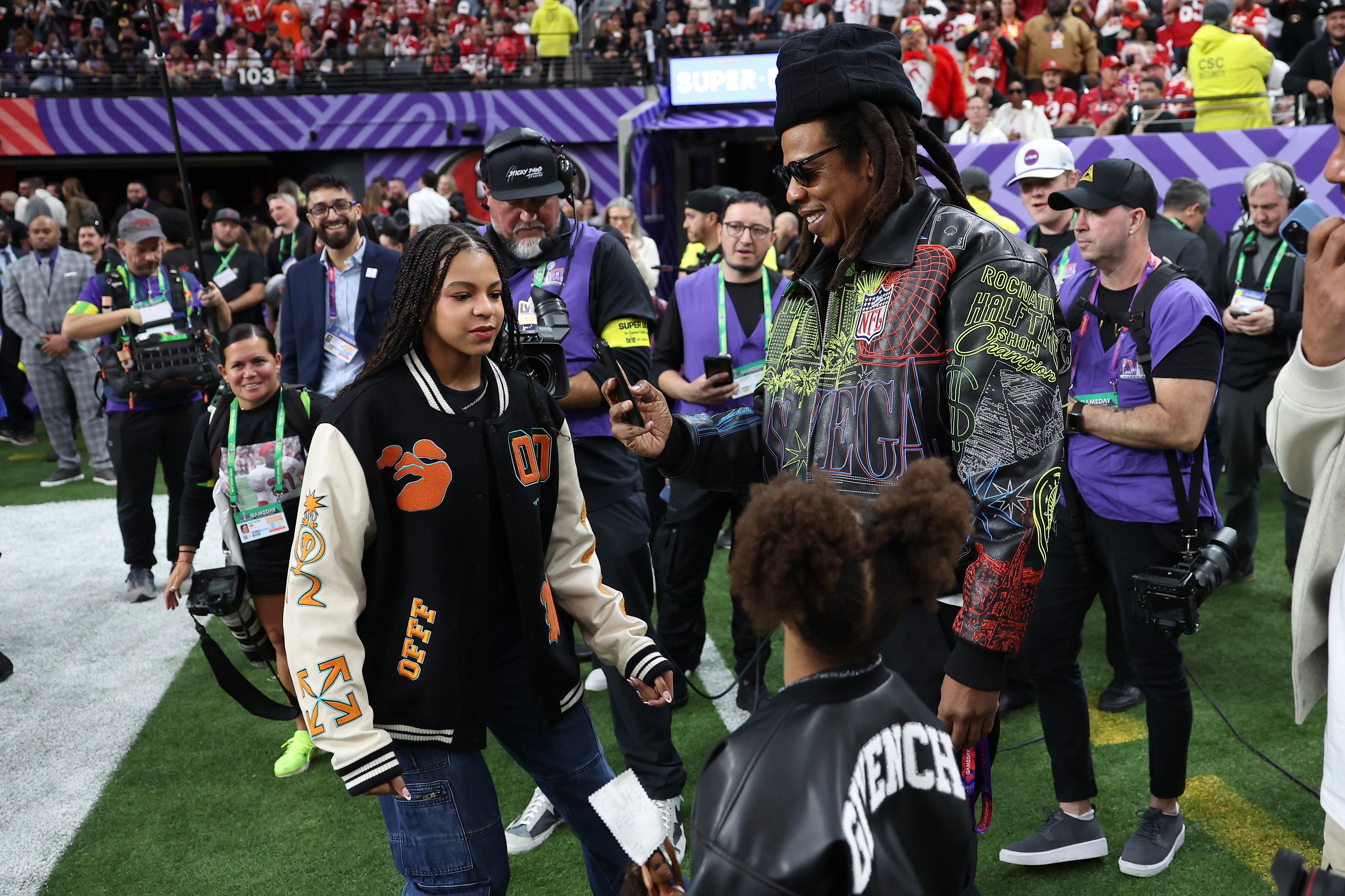 Blue Ivy Carter, Jay-Z and Rumi Carter are seen prior to Super Bowl LVIII at Allegiant Stadium on February 11, 2024 in Las Vegas, Nevada.<br><em>(Photo by Ezra Shaw/Getty Images)</em>