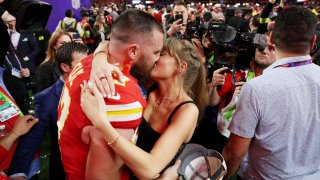 Travis Kelce #87 of the Kansas City Chiefs and Taylor Swift.