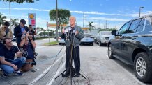 Peter Navarro speaks with reporters in Miami on March 19, 2024.