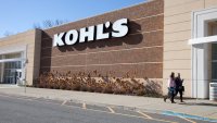 Shoppers walk in front of a Kohl’s store in Mount Kisco, New York.