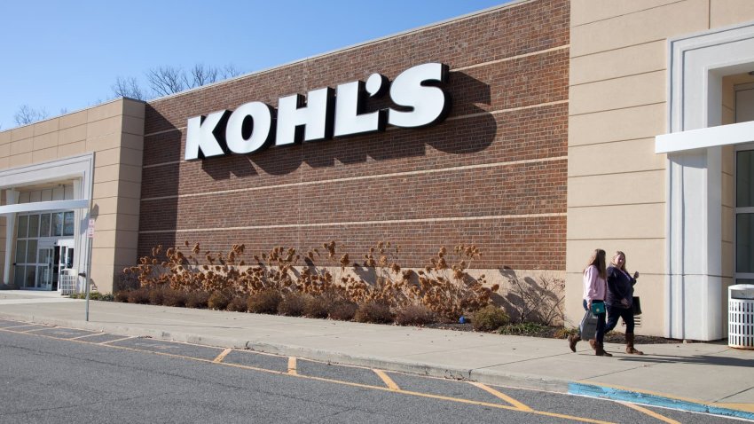 Shoppers walk in front of a Kohl’s store in Mount Kisco, New York.