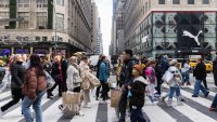 Shoppers walk along 5th Avenue on Black Friday in New York, US, on Friday, Nov. 25, 2022.